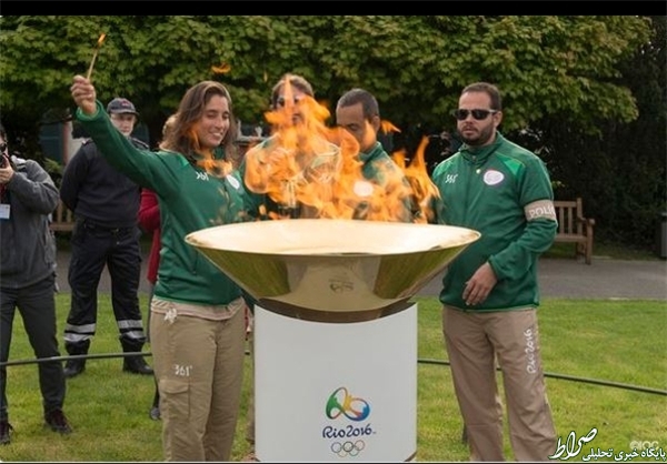 حمل مشعل المپیک توسط یک پناهده دیگر + عکس