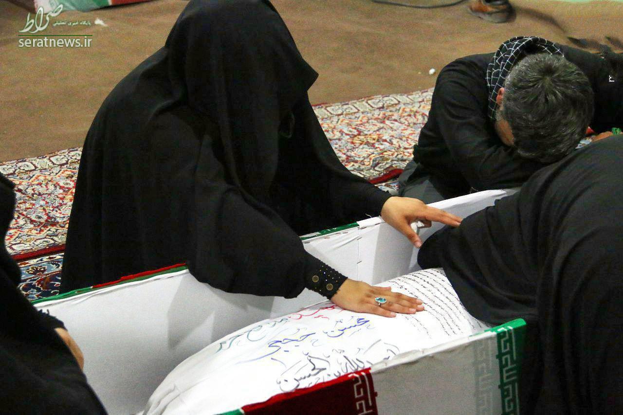 عکس/ وداع جانسوز همسر شهید حججی با پیکر شهید