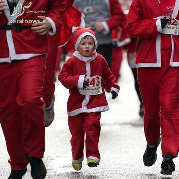 عکس/ ۷۰۰۰ نفر در مسابقه دو با لباس بابانوئل شرکت کردند