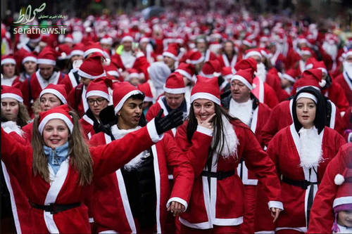 عکس/ ۷۰۰۰ نفر در مسابقه دو با لباس بابانوئل شرکت کردند