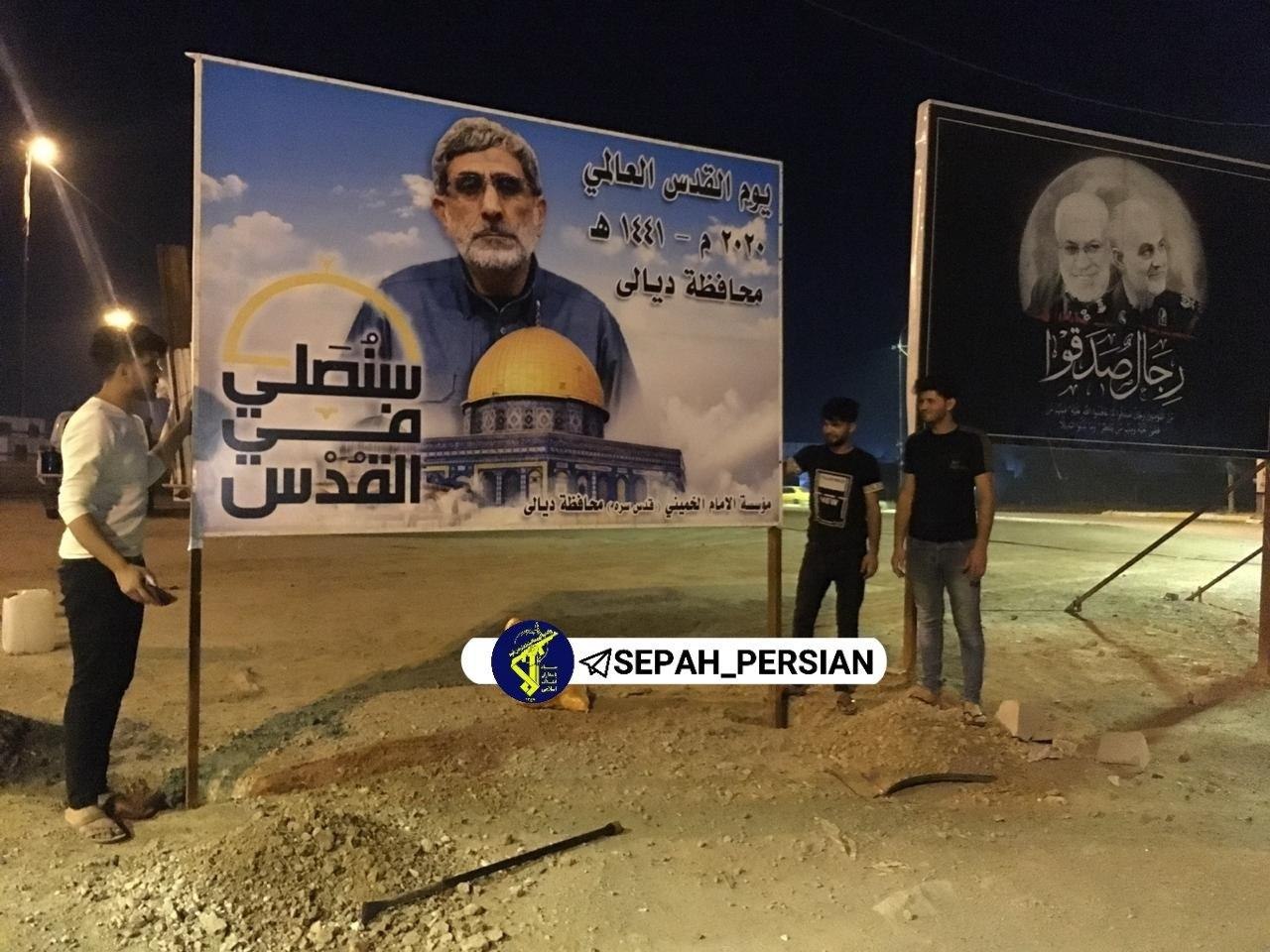 نصب پوستر سردار قاآنی در کنار شهید سلیمانی در عراق + عکس