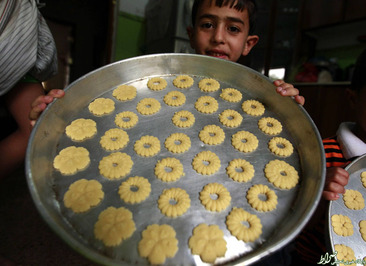 پختن شیرینی سنتی در پایتخت یمن به مناسبت عید فطر