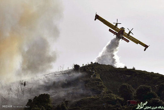خاموش کردن جنگل های آتش گرفته در شمال اسپانیا (EPA)