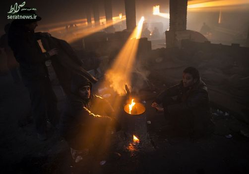 مهاجران و پناهجویان در یک انبار متروکه - بلگراد، صربستان