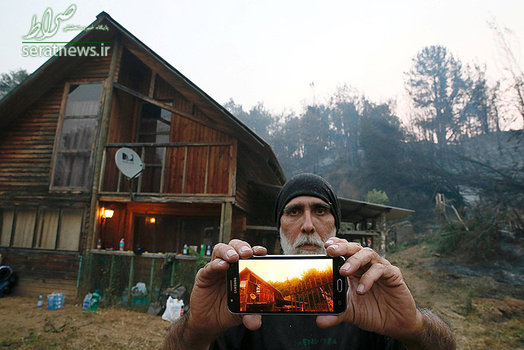 ماندن یک شهروند شیلی در خانه اش در پی آتش سوزی در مناطق مرکزی و جنوبی شیلی