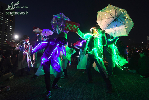 تظاهرات در کره جنوبی با لباس های روشن علیه پارک گئون هی رییس جمهور این کشور