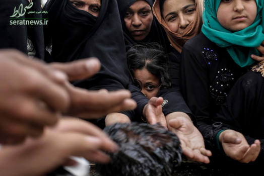 توزیع مواد غذایی بین ساکنان غرب موصل