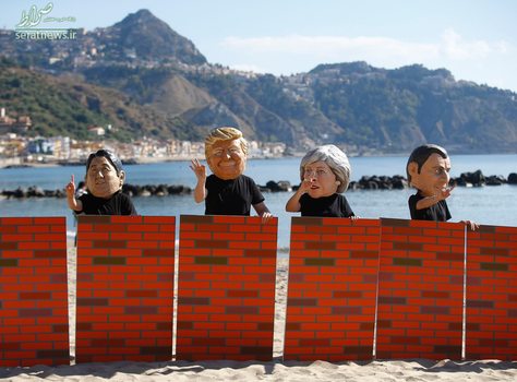 معترضان با ماسک شینزو آبه، دونالد ترامپ، ترزا می و امانوئل مکرون در حاشیه برگزاری اجلاس جی هفت در سیسیل ایتالیا