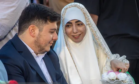 تصاویر| مراسم جشن پیوند ۱۱۰ زوج جان فدا در میدان آیینی امام حسین (ع)